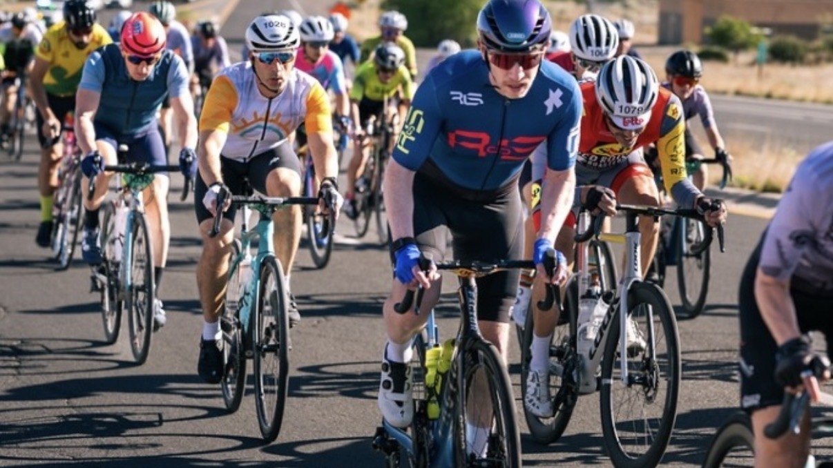 Jon Secrett, in a blue jersey, leading a group of riders at Ride Santa Barbara 100
